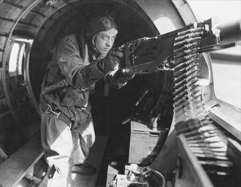 Staff Sergeant Maynard Smith at a Machine Gun in a B-17 Bomber