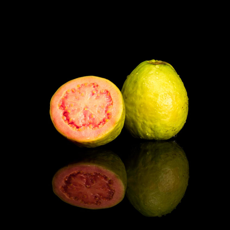 Red Guava Psidium Guajava on a Black Background